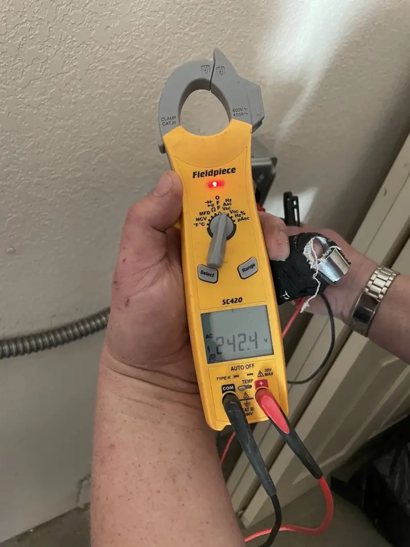 Voltage testing with clamp meter during Outlet Installation in Cocoa